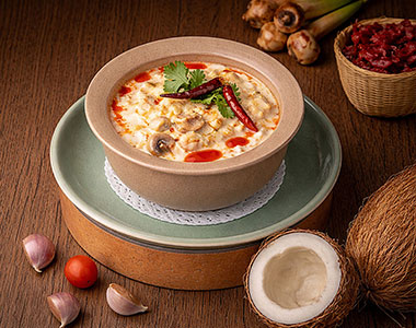 Tom Kha (ต้มข่า ไก่/กุ้ง) - Traditional Thai soup featuring tender chicken or prawns simmered in a creamy coconut broth - Angle 2