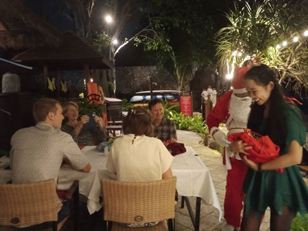 Anavana guests interacting with Santa and his helper