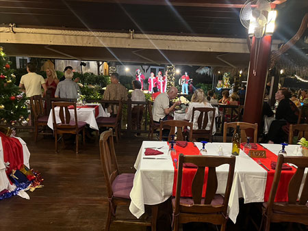 Children Christmas carolers photographed from inside Anavana restaurant