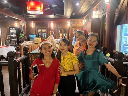 Anavana staff posing at the restaurant during Chrismas Eve dinner