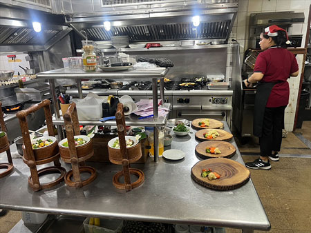 Staff preparing dinner in Anavana's kitchen