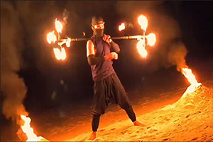 Koh Samui fire dancer perfoming on the beach at Anavana Beach resort
